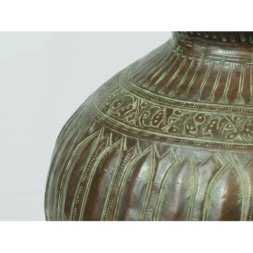 52 - Antique Persian Copper Vase.

Based on rounded base, rising to a lobbed globular body with a band of... 