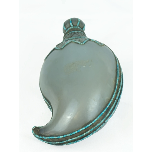 54 - A 19th century Moghol stone parfum bottle.
Of mango shape, neck and edges inset with tiny mosaic tur... 