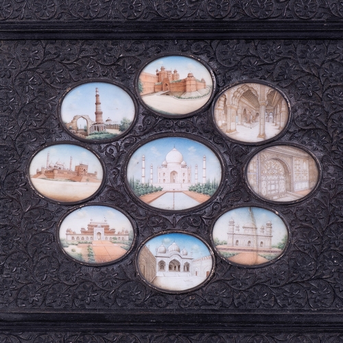 126 - A SET OF  NINE  INDIAN OVAL IVORY MINIATURES IN A FRAME, INDIA, 19TH CENTURY

Each depicting a Mugha... 