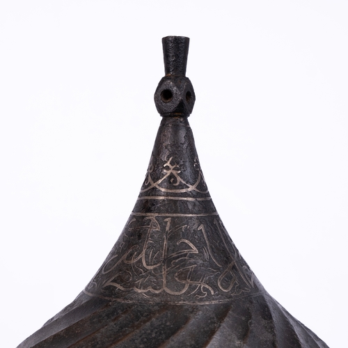 17 - A STEEL TURBAN HELMET, WESTERN IRAN OR ANATOLIA 

The body rising to a central finial, straight skul... 