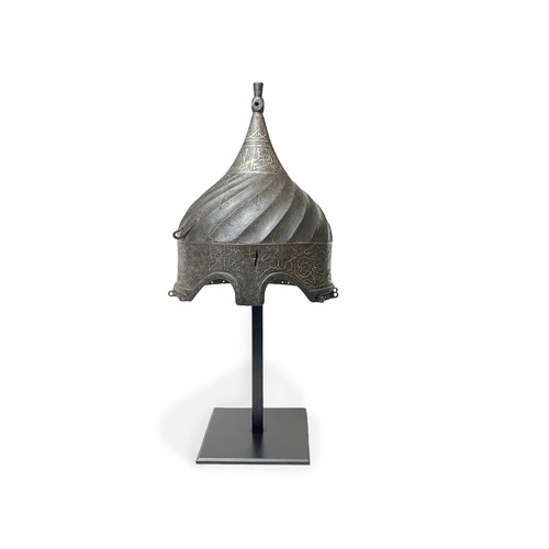 17 - A STEEL TURBAN HELMET, WESTERN IRAN OR ANATOLIA 

The body rising to a central finial, straight skul... 