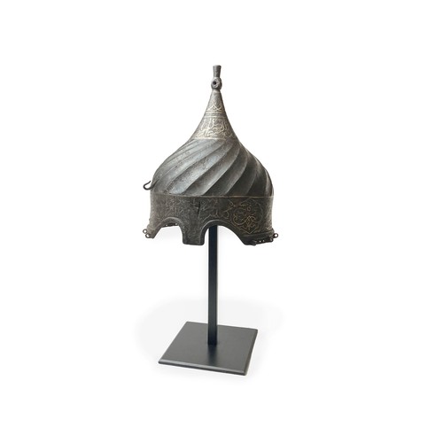 17 - A STEEL TURBAN HELMET, WESTERN IRAN OR ANATOLIA 

The body rising to a central finial, straight skul... 