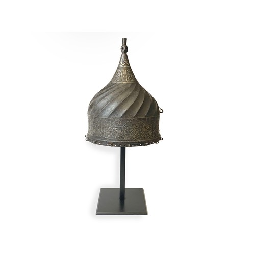 17 - A STEEL TURBAN HELMET, WESTERN IRAN OR ANATOLIA 

The body rising to a central finial, straight skul... 