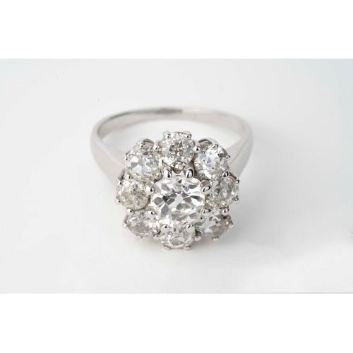 10 - White Gold Diamond Ring  

A diamond flower head ring, featuring a larger central diamond, complemen... 