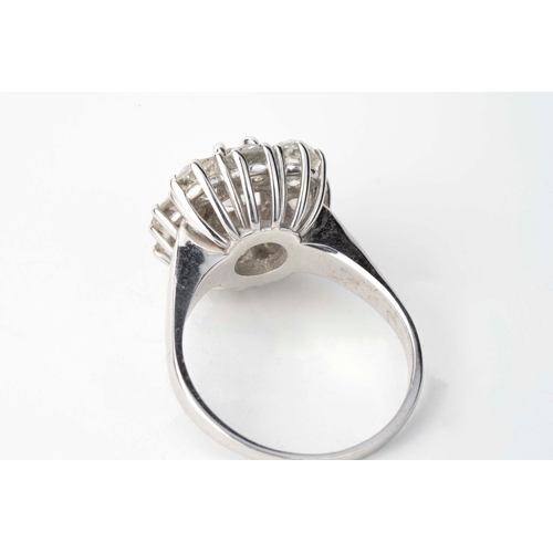 10 - White Gold Diamond Ring  

A diamond flower head ring, featuring a larger central diamond, complemen... 