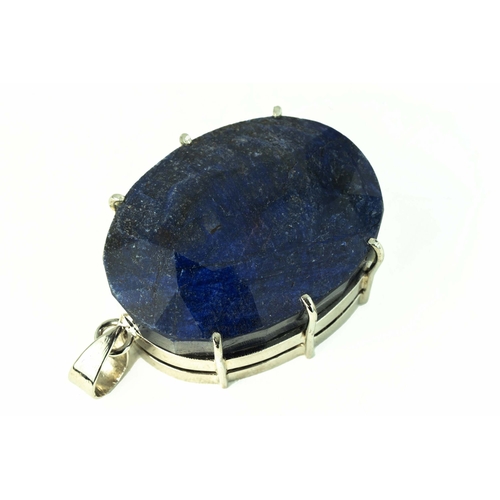 102 - Oval Shaped Faceted Corundum / Sapphire, Set As A Pendant In Silver 

50mm long 
36mm wide 
106 gram... 