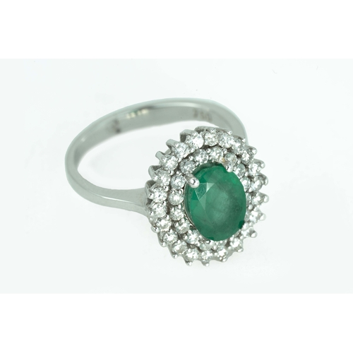 79 - Emerald and Diamond White Gold Ring

An oval-shaped emerald, surrounded by two rows of round diamond... 