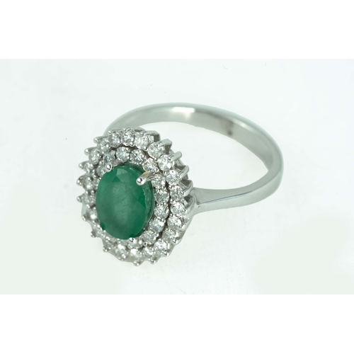 79 - Emerald and Diamond White Gold Ring

An oval-shaped emerald, surrounded by two rows of round diamond... 