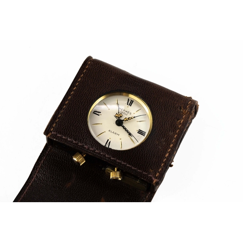 110 - Hermes Travel Alarm clock 

In original leather case, running but not timed, 43mm x 35mm x 10mm