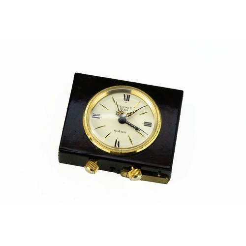 110 - Hermes Travel Alarm clock 

In original leather case, running but not timed, 43mm x 35mm x 10mm