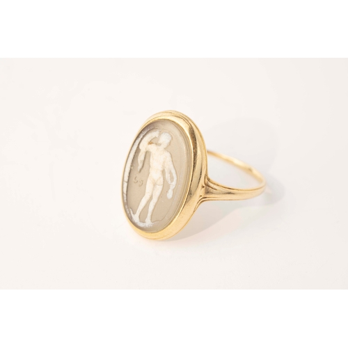 12 - Gold and Glass Cameo Ring   

An antique gold and glass ring, the oval signet style ring with centra... 