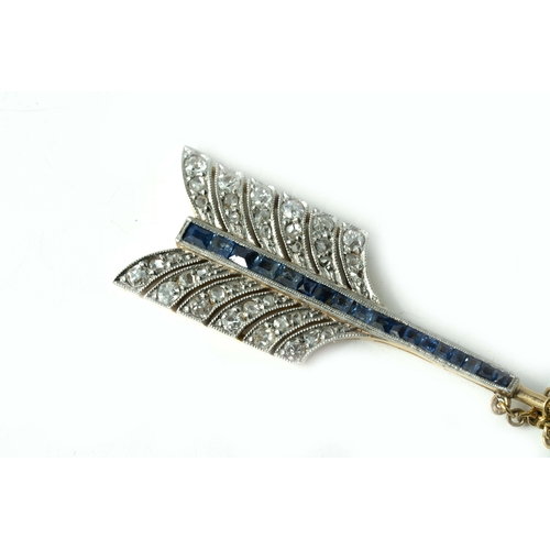 128 - A Gold And Platinum Lapel/Hat Pin

A Gold and Platinum, Sapphire And Diamond Arrow Lapel/Hat Pin, 8.... 