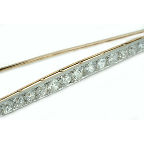 129 - Gold And Platinum Diamond Brooch 

Approx 5ct ttw old-mine diamonds, 91mm long, 6.5 grams, 15K Gold