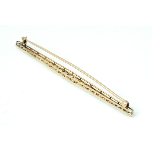 129 - Gold And Platinum Diamond Brooch 

Approx 5ct ttw old-mine diamonds, 91mm long, 6.5 grams, 15K Gold