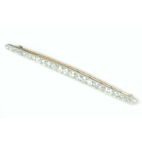 129 - Gold And Platinum Diamond Brooch 

Approx 5ct ttw old-mine diamonds, 91mm long, 6.5 grams, 15K Gold