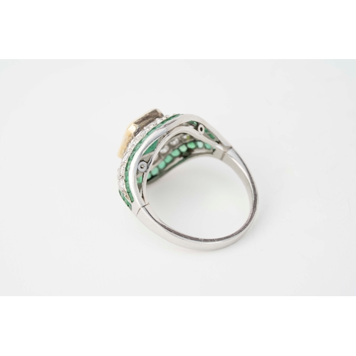 15 - Platinum Diamond and Emerald Ring

Platinum diamond and emerald ring, featuring a captivating square... 