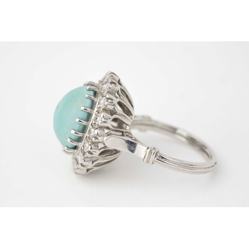 22 - Turquoise and Diamond Ring   

A Turquoise and Diamond ring, with a vibrant oval-shaped turquoise ca... 