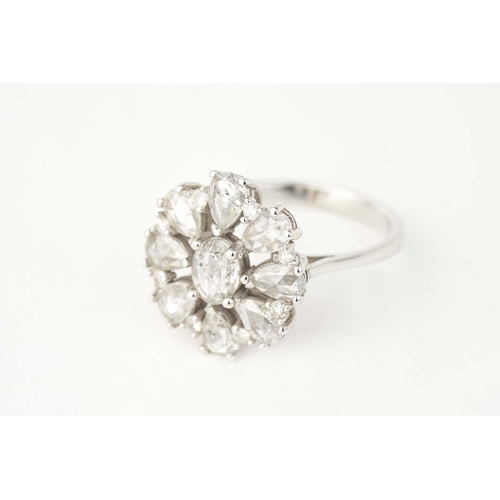 25 - A  Sunburst Diamond Ring  

A sunburst diamond ring, an oval-shaped diamond to centre, an array of r... 