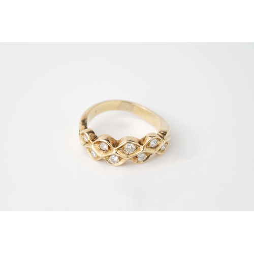 26 - A Diamond Yellow Gold Ring  

Diamonds set within a honeycomb shaped yellow gold, brilliant cut diam... 