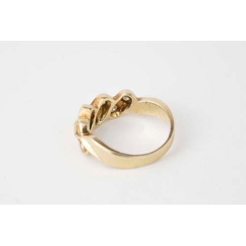 26 - A Diamond Yellow Gold Ring  

Diamonds set within a honeycomb shaped yellow gold, brilliant cut diam... 