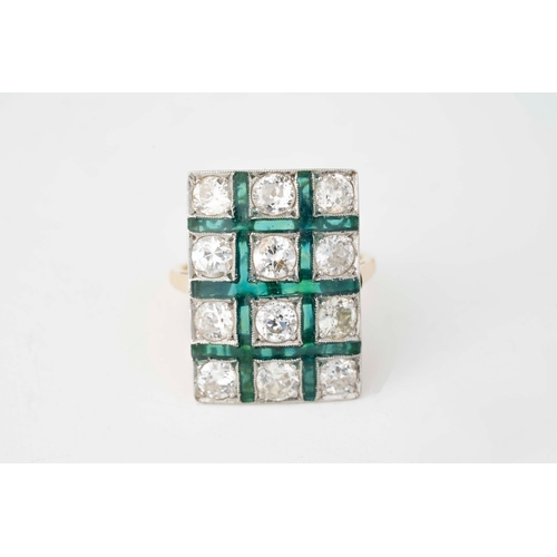 28 - Diamond and Cold Green Enamel White Gold Ring   

A white gold ring with an array of diamonds surrou... 