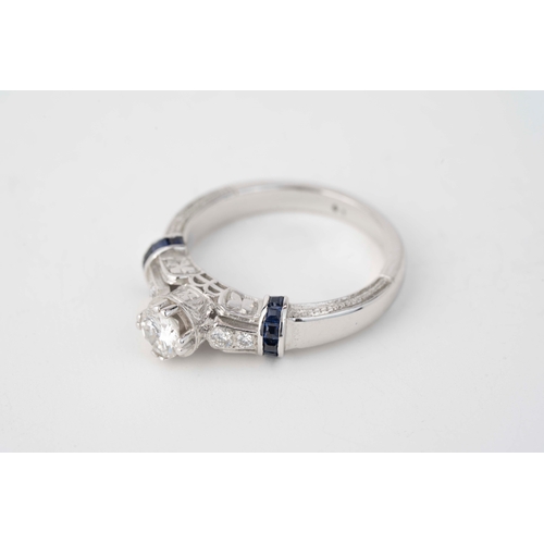 29 - Gold and 0.50ct Diamond Ring  

A diamond and sapphire ring, a round diamond to centre, further two ... 