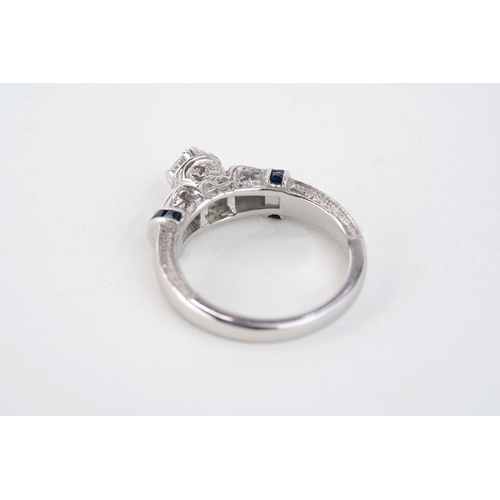 29 - Gold and 0.50ct Diamond Ring  

A diamond and sapphire ring, a round diamond to centre, further two ... 