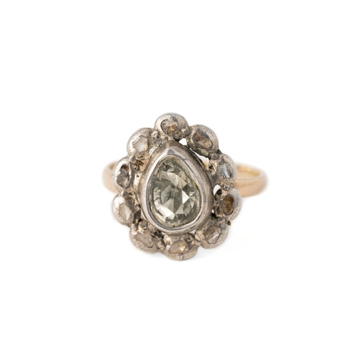 36 - Gold, 1.20ct diamond and Silver Ring

A gold and diamond ring, with a pear-shaped rose-cut diamond, ... 