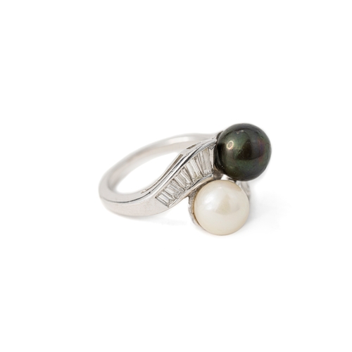 44 - Black and White Pearl and Diamond Platinum Ring   

A pearl and diamond ring, featuring a white and ... 