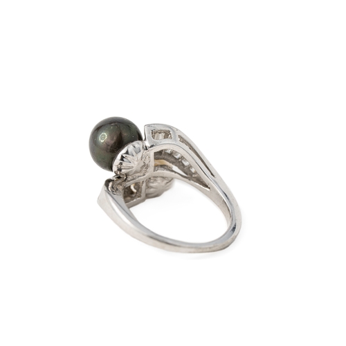 44 - Black and White Pearl and Diamond Platinum Ring   

A pearl and diamond ring, featuring a white and ... 