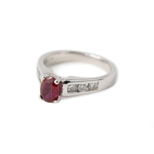 45 - A Ruby and Diamond Gold Ring   

A diamond and ruby ring, a square-cut ruby to centre, secured with ... 