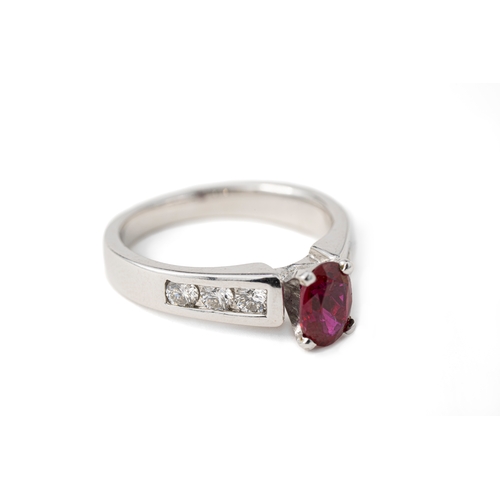 45 - A Ruby and Diamond Gold Ring   

A diamond and ruby ring, a square-cut ruby to centre, secured with ... 