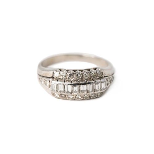 51 - A Diamond White Gold Band Ring

A diamond ring with a sequence of baguette stones with tiers of roun... 