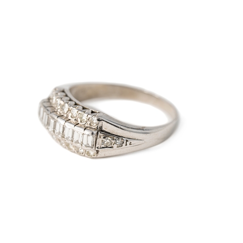 51 - A Diamond White Gold Band Ring

A diamond ring with a sequence of baguette stones with tiers of roun... 