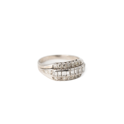 51 - A Diamond White Gold Band Ring

A diamond ring with a sequence of baguette stones with tiers of roun... 