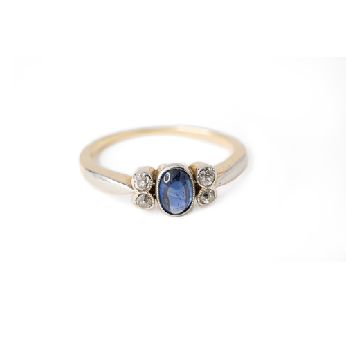 52 - A Sapphire and Diamond Ring

A cabochon sapphire and diamond ring, an oval-shaped sapphire to centre... 