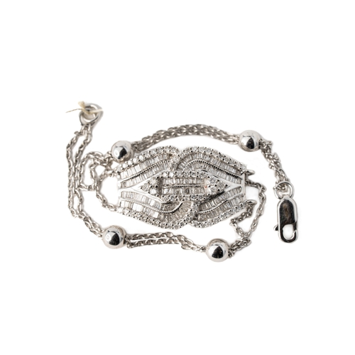 54 - A White Gold Art Deco Diamond Bracelet

An Art Deco bracelet crafted from 18K White gold and diamond... 