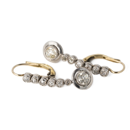 55 - White Gold Old-Cut Diamond Earrings

Each of drop design, the surmount set with a round diamond, sus... 