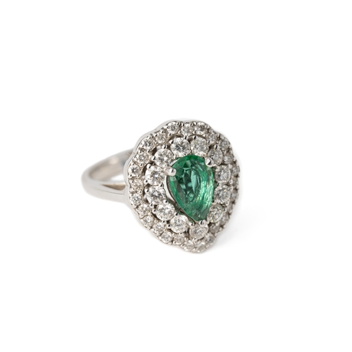 59 - A Pear-Shaped Emerald and Diamond Gold Ring

A pear-shaped emerald, surrounded by two rows of round ... 