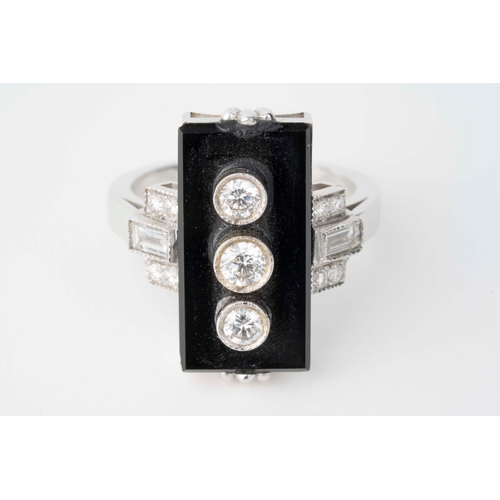 6 - Onyx and Diamond Art Deco White Gold Ring   

A white gold ring in the style of Art-Deco featuring a... 