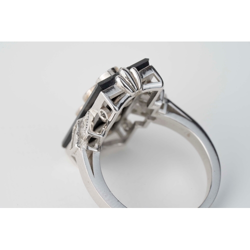 6 - Onyx and Diamond Art Deco White Gold Ring   

A white gold ring in the style of Art-Deco featuring a... 