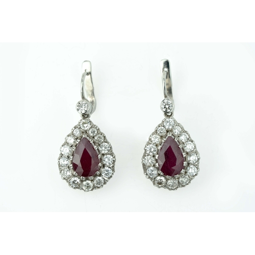 60 - A Pair Of Ruby And Diamond Earrings  

A pair of diamond earrings with two pear-shaped 7mm wide rubi... 