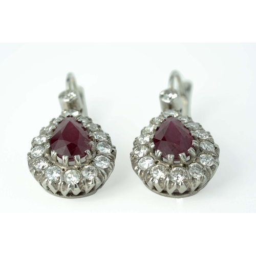 60 - A Pair Of Ruby And Diamond Earrings  

A pair of diamond earrings with two pear-shaped 7mm wide rubi... 