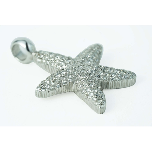 63 - White Gold Starfish Pendant With Diamonds 

The starfish pendant enhanced with beautiful round cut d... 