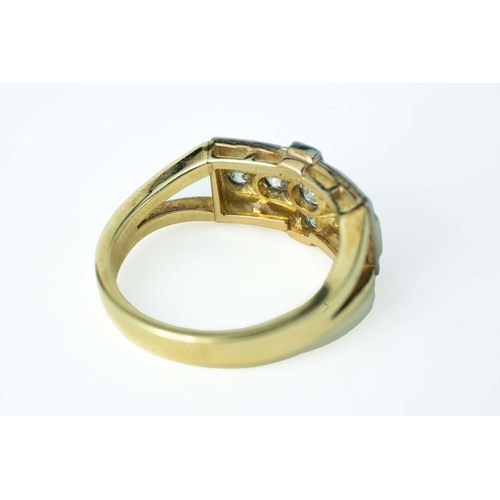 65 - A Cross-Shaped Diamond Gold Ring 

A diamond ring, set with round diamonds in a cross-shaped millgra... 