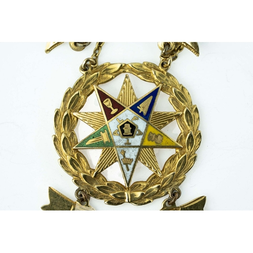 82 - Gold and Enamel Masonic Medal

A masonic medal showcasing a ten-pointed star positioned within a wre... 