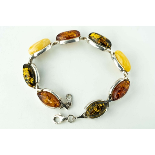 89 - Silver And Amber Bracelet

A bracelet crafted from silver, adorned with a collection of eight amber ... 