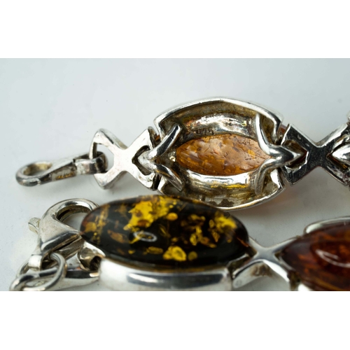 89 - Silver And Amber Bracelet

A bracelet crafted from silver, adorned with a collection of eight amber ... 