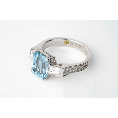 9 - Diamond and Aqua Marine  White Gold  Ring   

An aquamarine and diamond ring, the emerald cut aquama... 