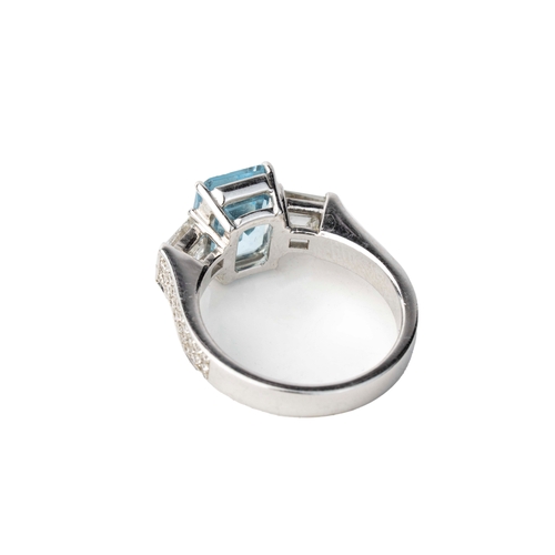 9 - Diamond and Aqua Marine  White Gold  Ring   

An aquamarine and diamond ring, the emerald cut aquama... 